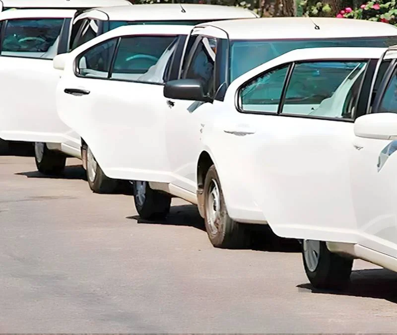 a row of white cars
